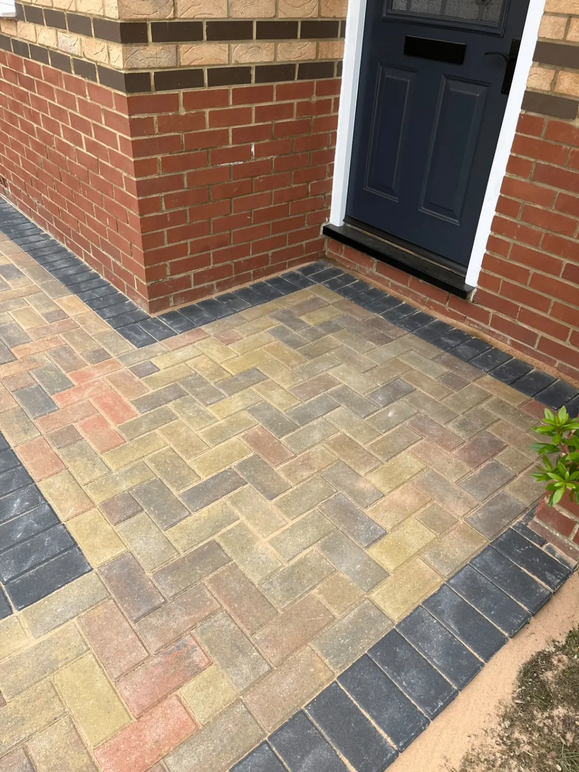Close-up of block paving and charcoal border