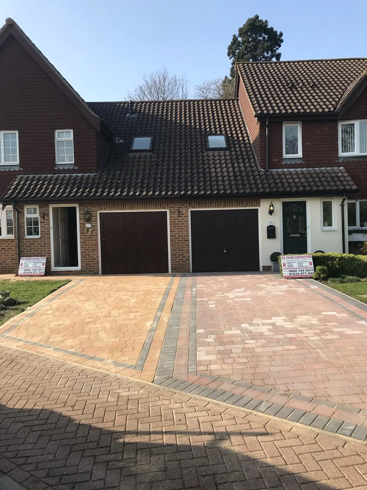Large block paved driveway in mixed warm tones